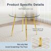 A modern minimalist style round transparent tempered glass table with gold metal legs