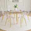 A modern minimalist style round transparent tempered glass table with gold metal legs