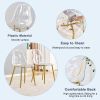 A modern minimalist style round transparent tempered glass table with gold metal legs
