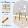 A modern minimalist style round transparent tempered glass table with gold metal legs